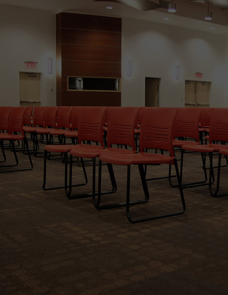 Rows of chairs on carpet