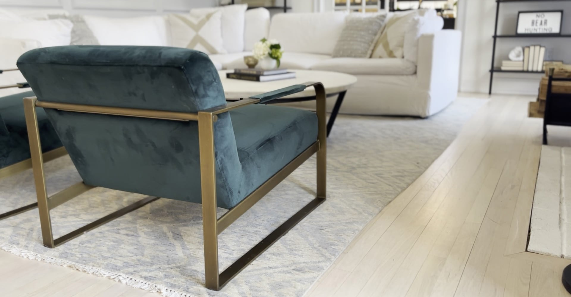 Dad pushing Daughter in Cardboard box on Hardwood Floors in Home.